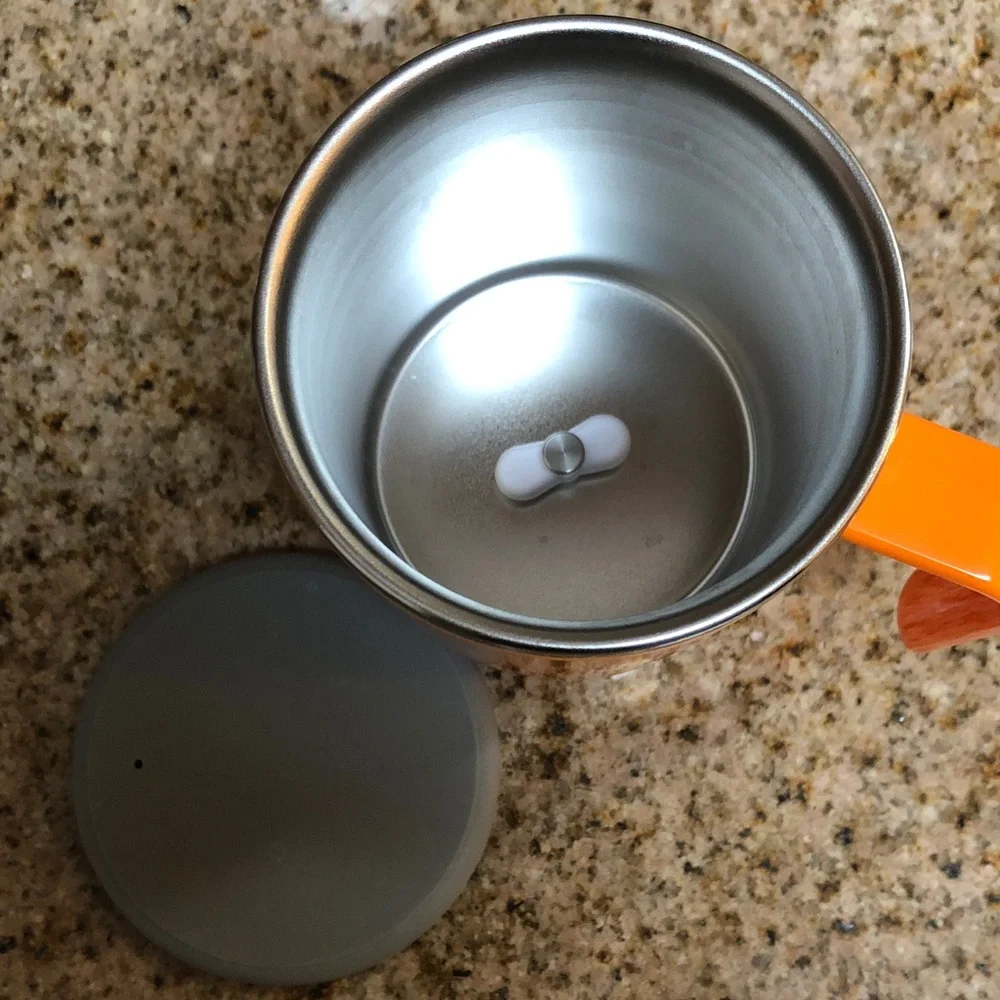 Black Electric Coffee Grinder with French Press and Orange Travel Mug